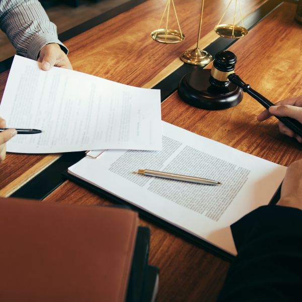 Client is bringing the documents to clarify the law to the lawyer at the prosecutor office.