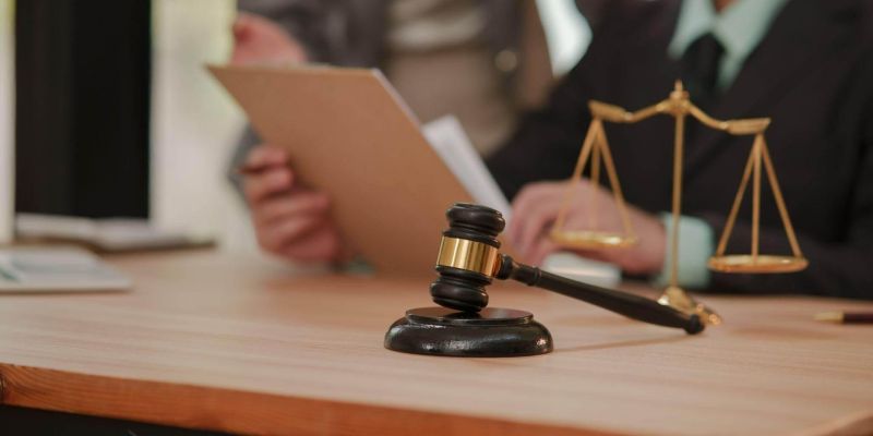Judge's gavel on wooden table