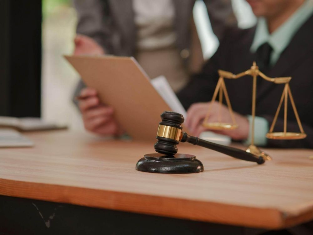 Judge's gavel on wooden table