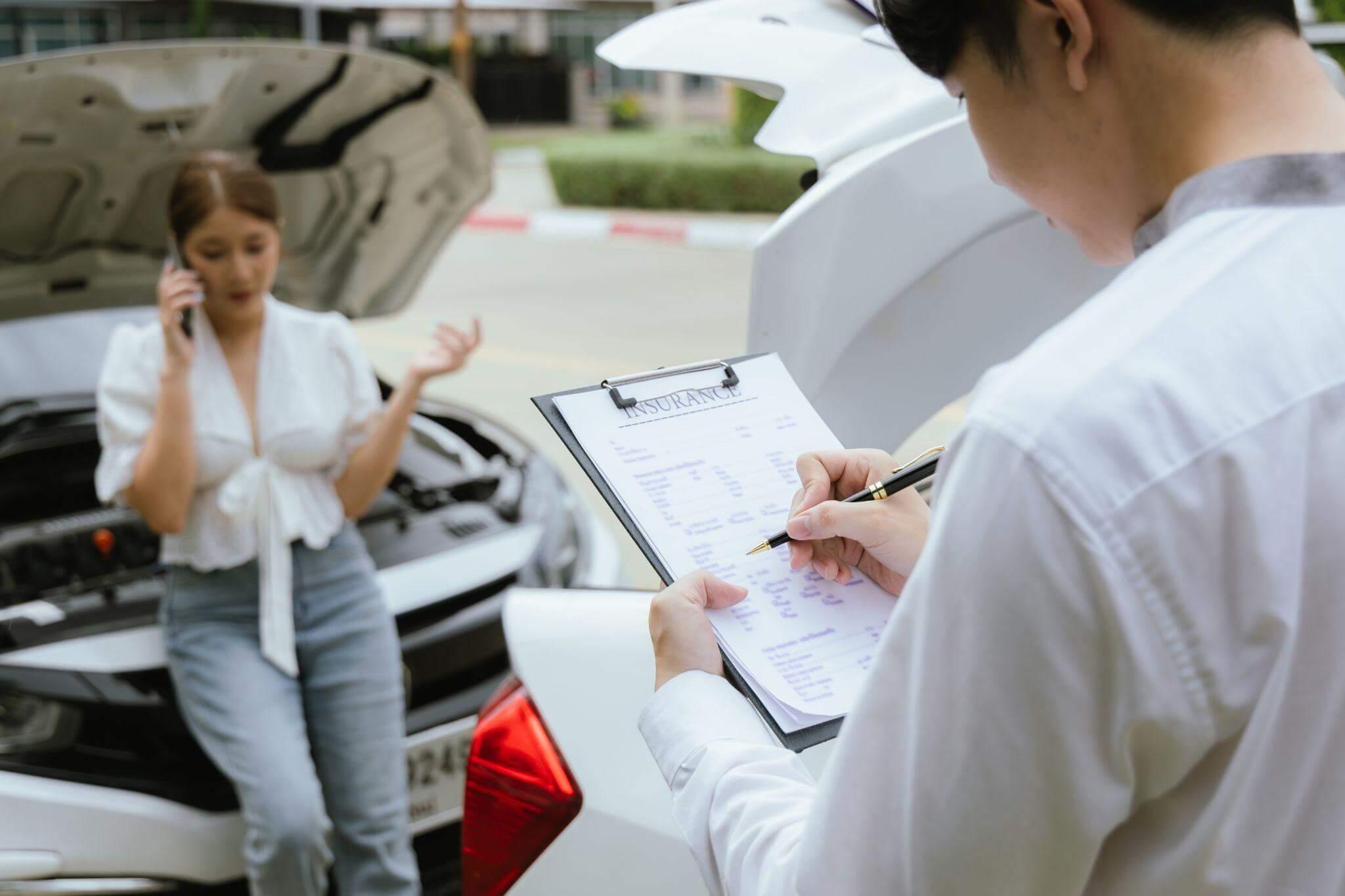 a woman standing next to a car holding a clipboard