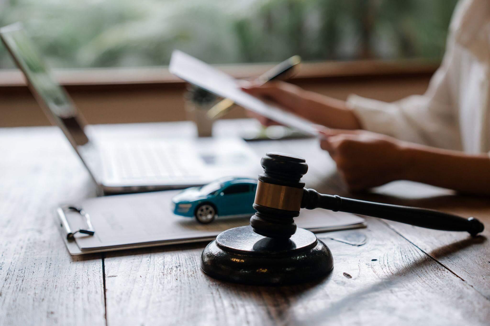 Laptop on a wooden table, symbolizing a client review